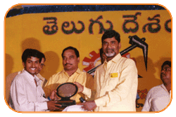 Mr. N Bitra Receiving A memento from Sri. N Chandra Babu Naidu, Ex. Chief Minister of Andhra Pradesh, India. Mr. N Bitra Receiving A memento from Sri. N Chandra Babu Naidu, Ex. Chief Minister of Andhra Pradesh, India.