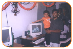 Mr. N Bitra Receiving A memento from Pinnamaneni Venkateswara Rao, Minister Technical Education, on the occasion of 56th Independence Day (15th August 2003). Bitra Net Pvt. Ltd., has donated two letest configuration computers to a School located in Puttagunta (Krishna Dist, Andhra Pradesh)