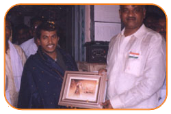 Mr. N Bitra Receiving A memento from Pinnamaneni Venkateswara Rao, Minister Technical Education, on the occasion of 56th Independence Day (15th August 2003). Bitra Net Pvt. Ltd., has donated two letest configuration computers to a School located in Puttagunta (Krishna Dist, Andhra Pradesh) Mr. N Bitra Receiving A memento from Pinnamaneni Venkateswara Rao, Minister Technical Education, on the occasion of 56th Independence Day (15th August 2003). Bitra Net Pvt. Ltd., has donated two letest configuration computers to a School located in Puttagunta (Krishna Dist, Andhra Pradesh)